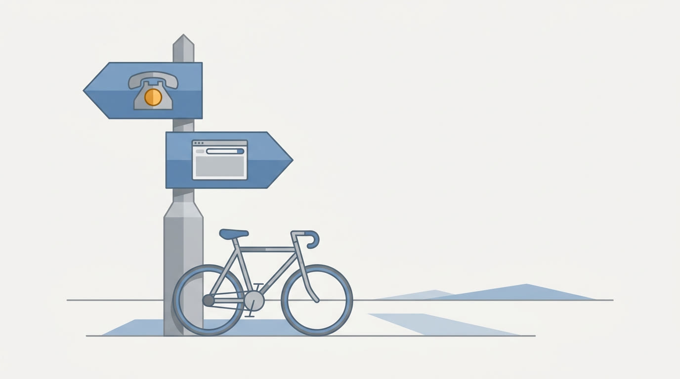 A flat illustration of an open road signpost with one arrow marked by a phone icon and the other by a small browser window shape, a bicycle leaning at its base, grey and blue palette with one warm amber accent